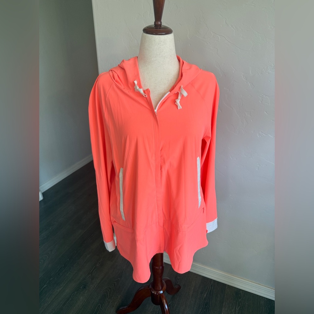 Women’s Lululemon Sun Showers Jacket in grapefruit and white. Size 10